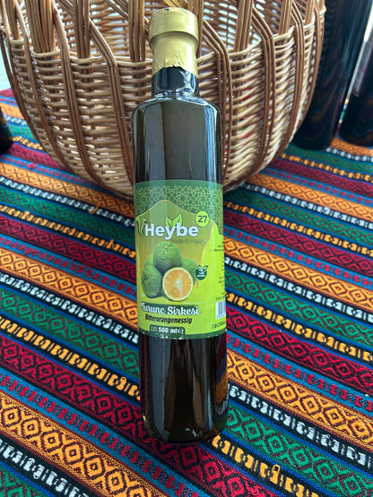 Bitter Orange Vinegar 500 ml in a dark bottle with green label and citrus fruit illustration