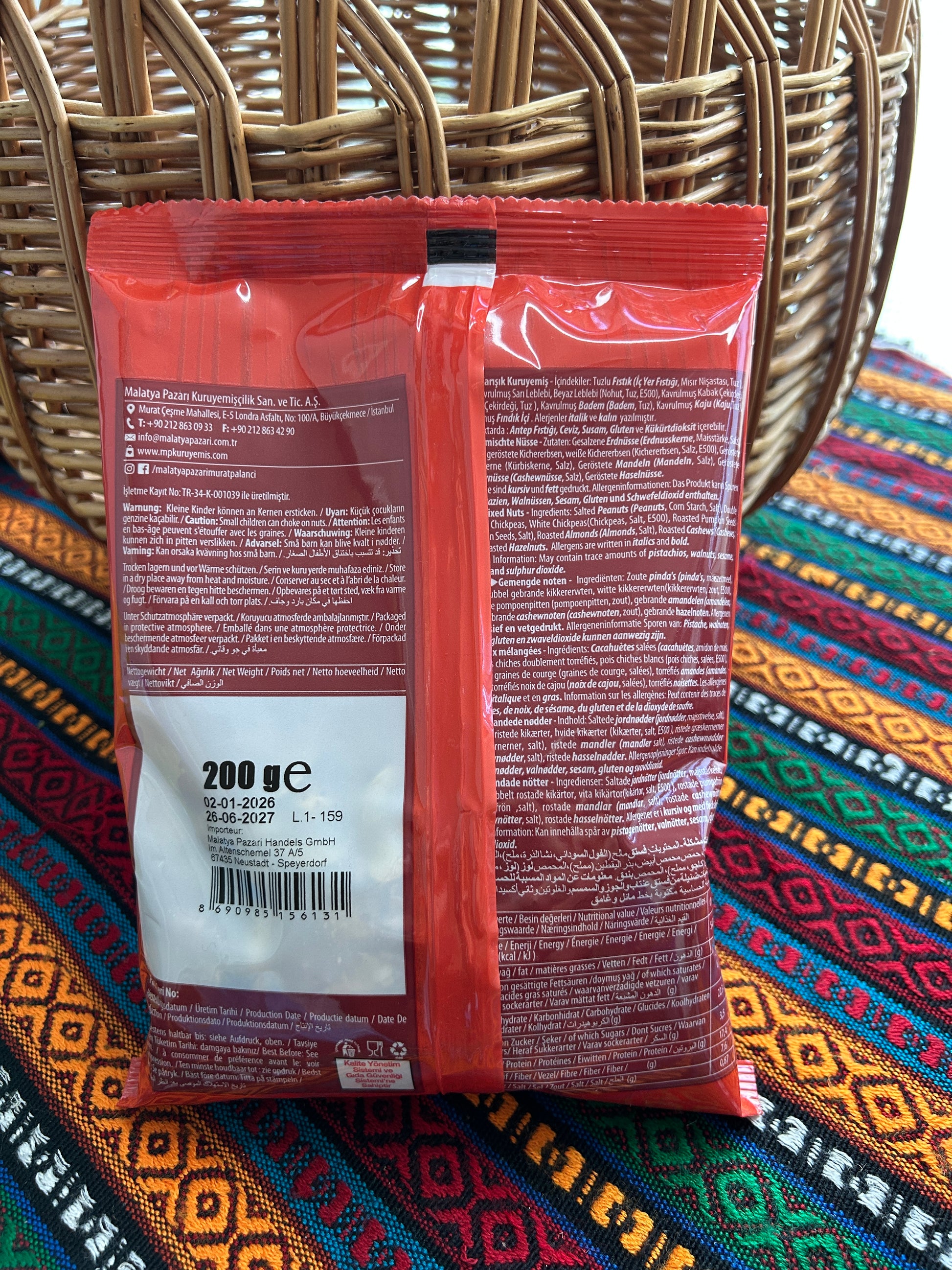 Back of the Economix mixed nuts bag showing ingredients, allergens and product information