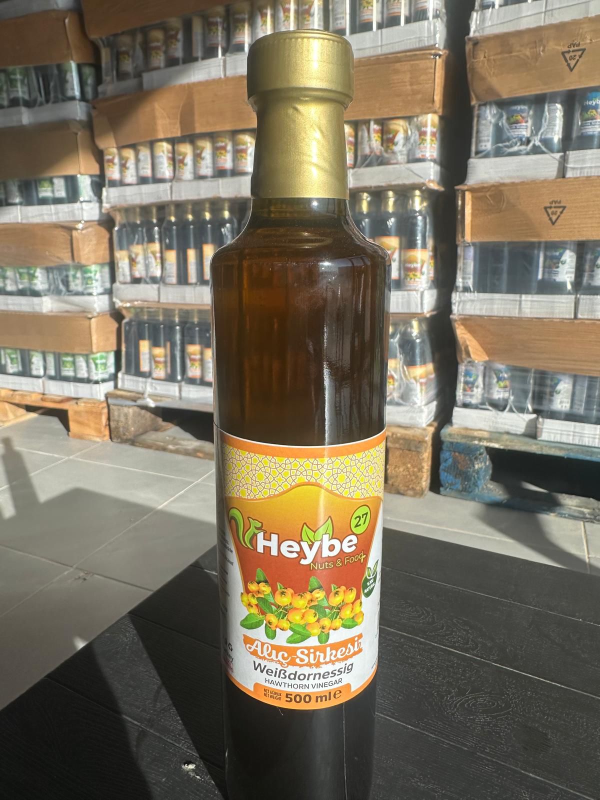 Hawthorn Vinegar 500 ml in a dark bottle with gold-coloured label and fruit illustration