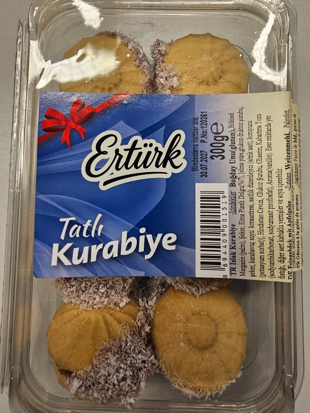 Ertürk Islak Kurabiye with red filling and coconut flakes in a transparent 300 g pack