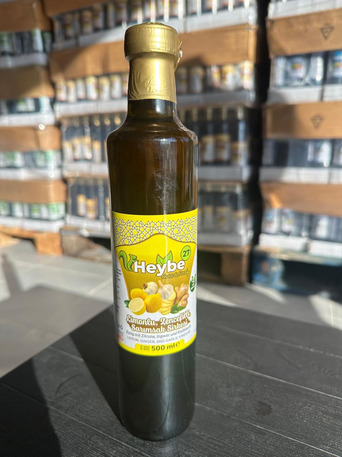 Lemon, Ginger and Garlic Vinegar in a dark 500 ml bottle with yellow label