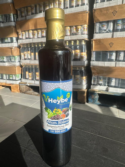 Atom Vinegar Mix 500 ml in a dark bottle with blue fruit label