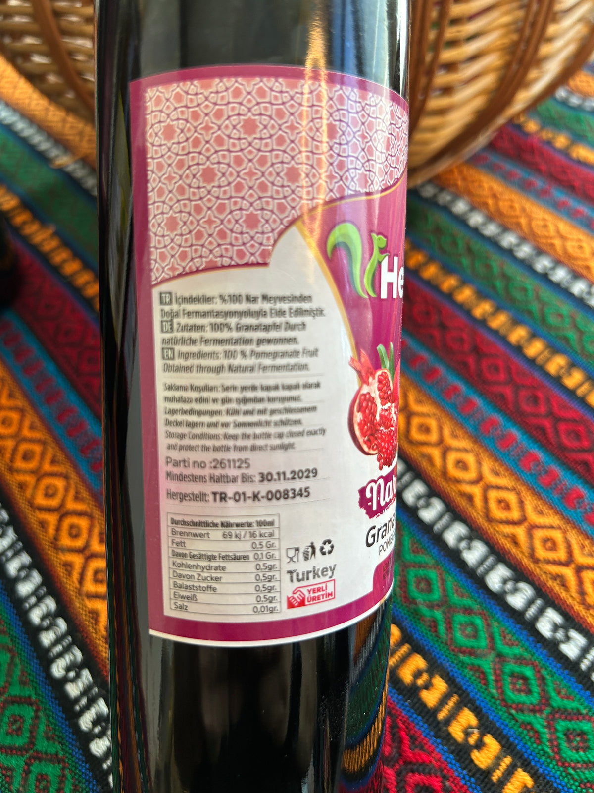 Close-up of Heybe pomegranate vinegar label showing ingredients and nutritional values
