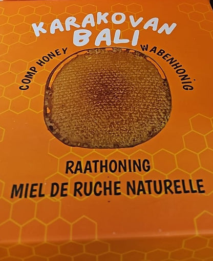 Orange Karakovan Balı cardboard lid with a printed photograph of a honeycomb