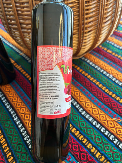 Close-up of a dark Rose Vinegar bottle showing ingredients and nutritional information