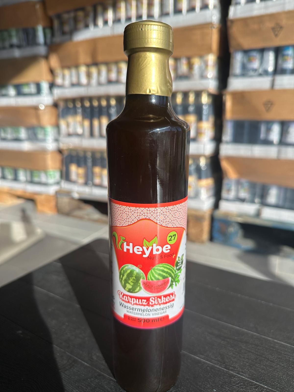 Watermelon Vinegar 500 ml in a dark bottle with red label and watermelon illustration