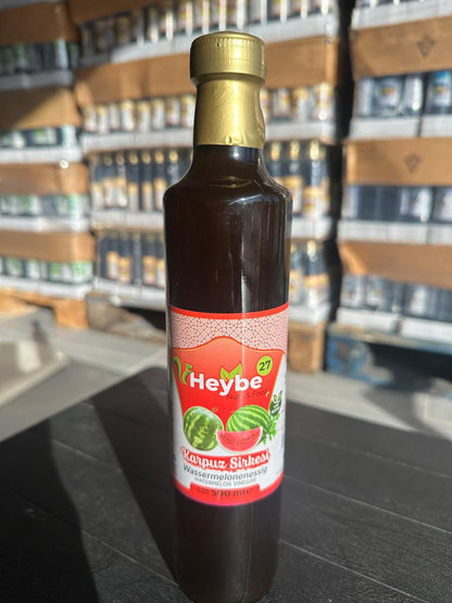 Watermelon Vinegar 500 ml in a dark bottle with red label and watermelon illustration