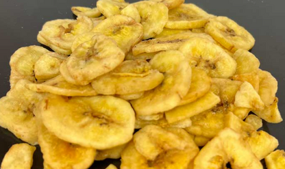 Close-up of dried banana slices on a dark background