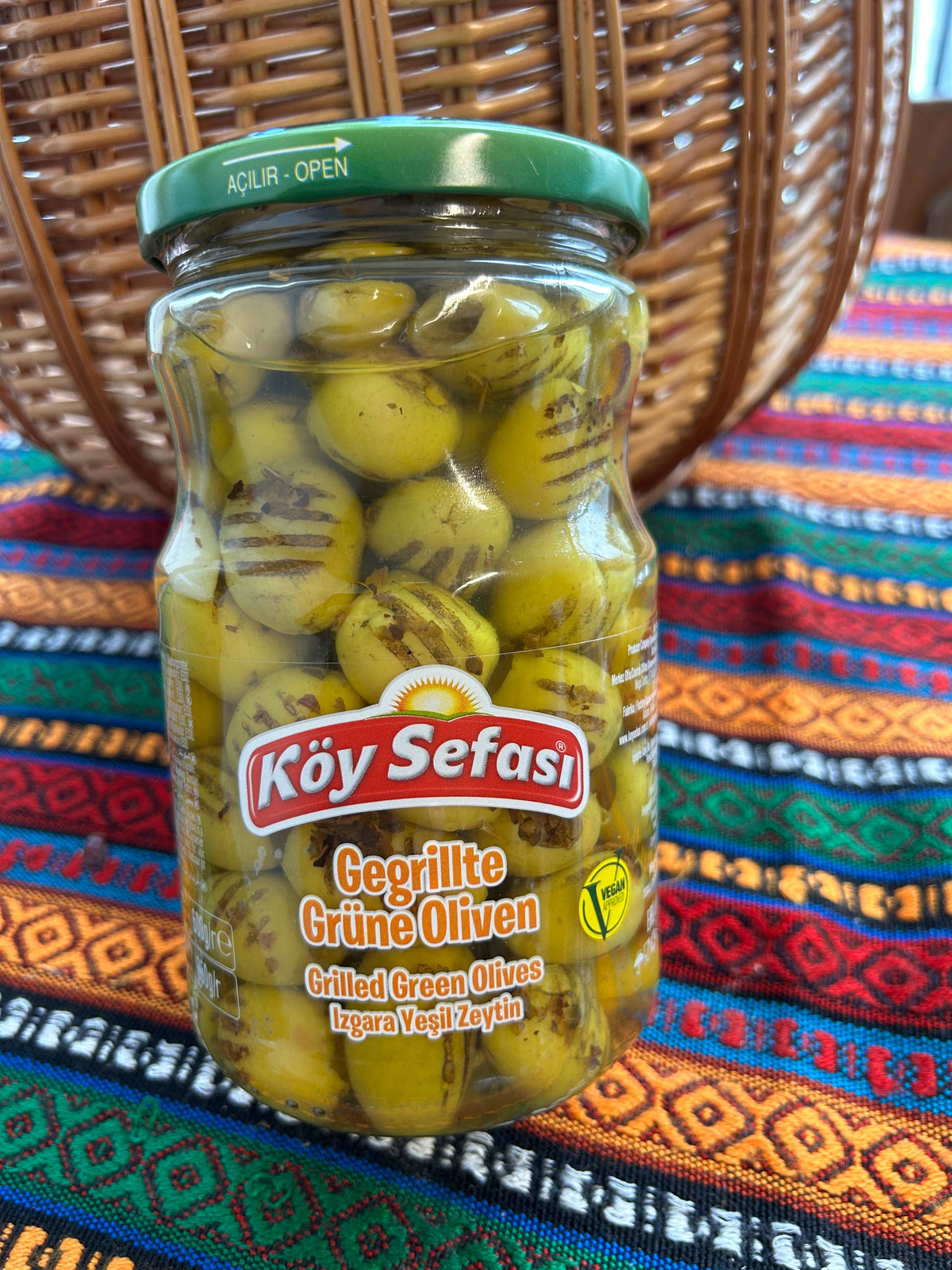 Köy Sefası grilled green olives in a glass jar with green lid and visible front label