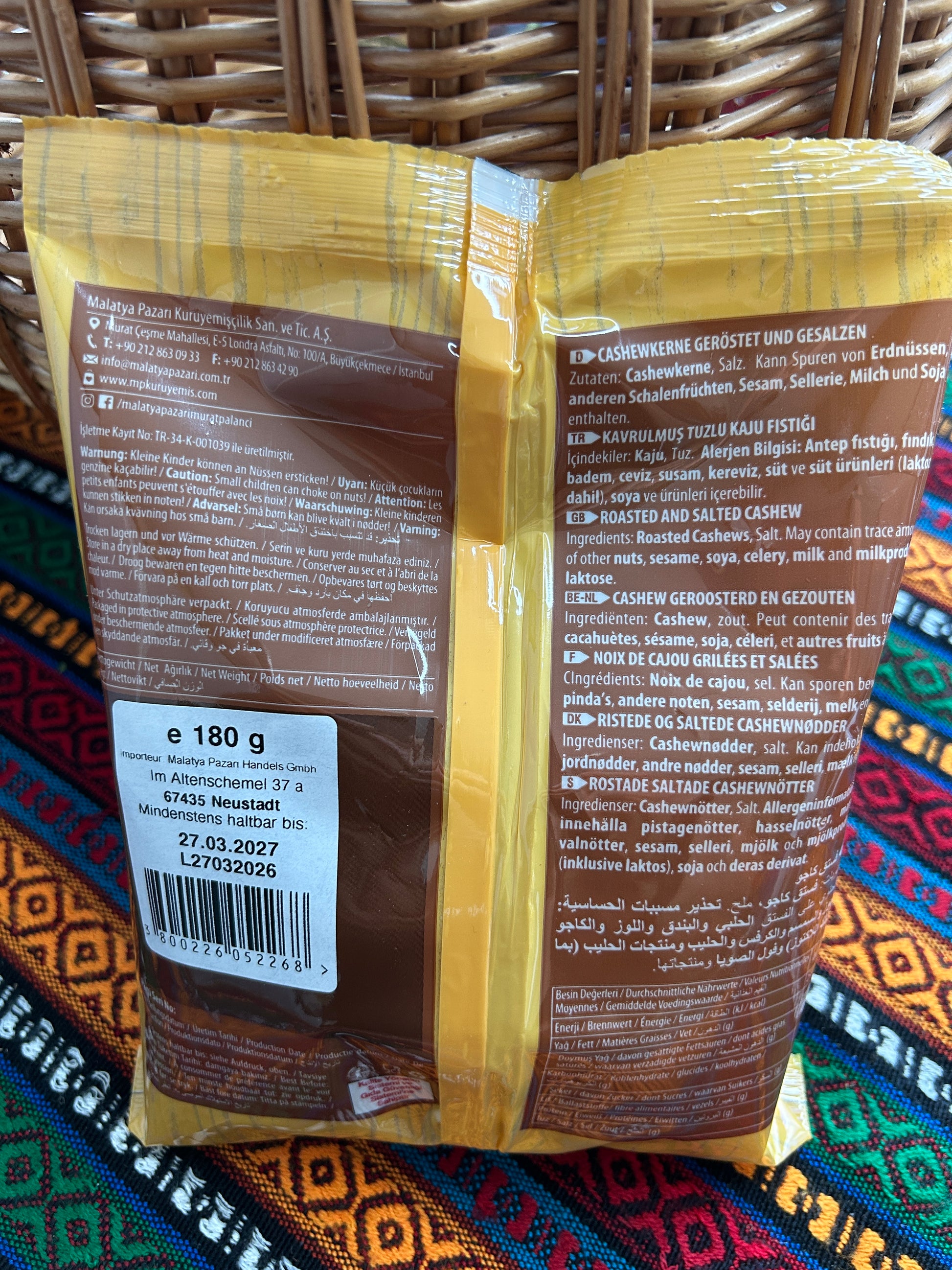Back of the roasted cashew package showing ingredients, allergens and storage information