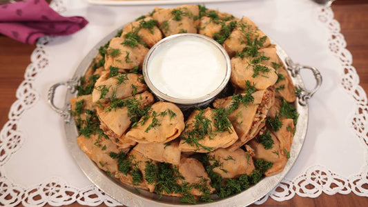 Hollow dried zucchini filled with rice and served with yogurt